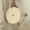 Easily holding the stool with hands
