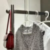 The overnight clothes rack is hung with a bag