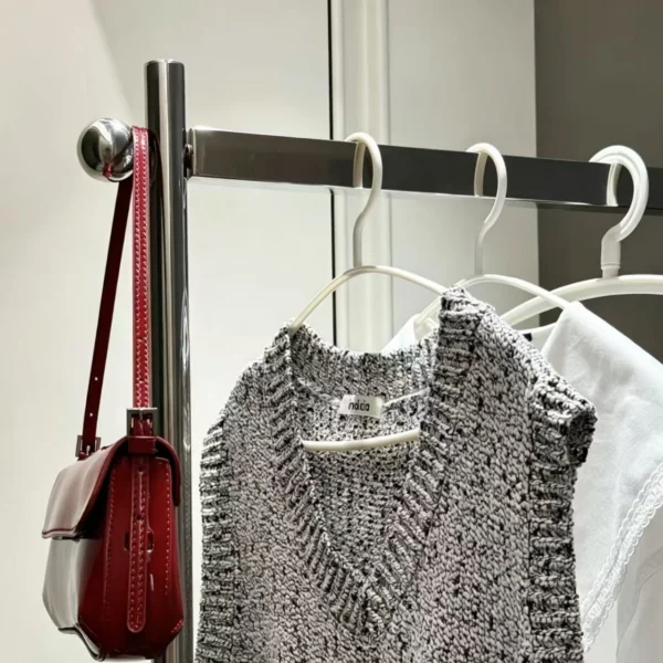 The overnight clothes rack is hung with a bag